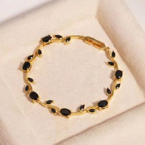 Elegant Gold Bracelet with Blue Stones