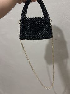 Hand made black pearls sling bag