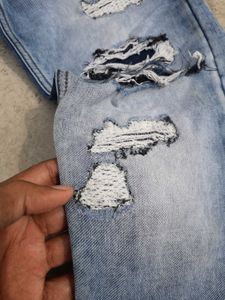 Distressed Blue Denim Jeans