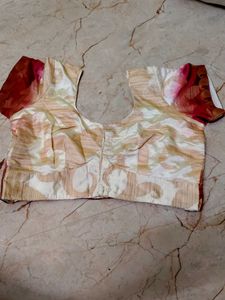 pink border with a cream colour blouse