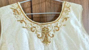 Elegant Off-White Dress with Gold Embellishments