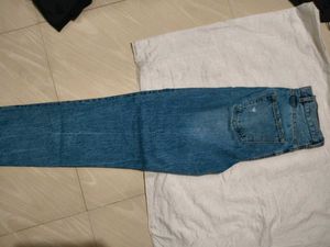 Distressed Blue Denim Jeans