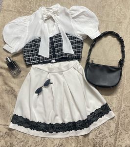 Elegant Off-White Skirt with Black Lace Trim