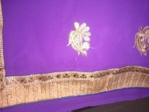 Vibrant Purple Saree with Gold Embellishments