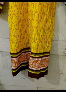 a )Yellow Printed Kurti with knot at back