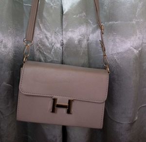 Stylish Beige Handbag with “H” Logo