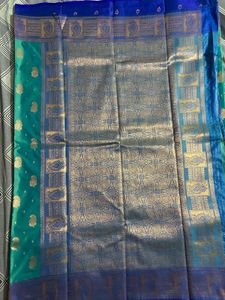 Elegant Teal Saree with Gold Paisley