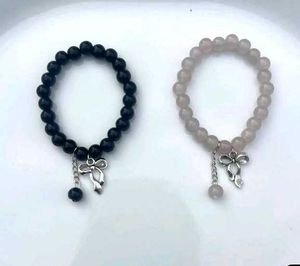 pair ribbon Beaded Charm Bracelets