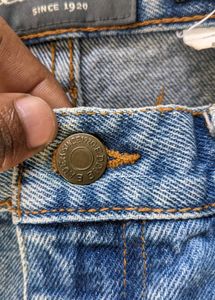Distressed Blue Denim Jeans