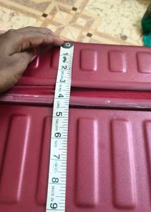 Maroon Hard Shell Luggage Handel grip is broken