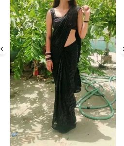 Black Saree With Padded Sleevless Blouse.