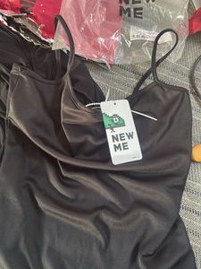 Chic Black Ruched Mini Dress in medium size