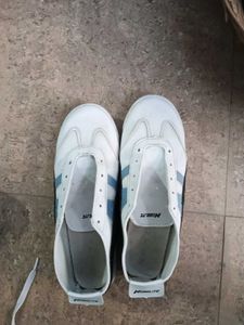 White Casual Sneakers with Blue Stripes