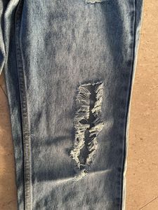Distressed Blue Denim Jeans