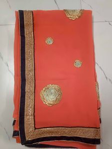 Orange Saree with Embroidered Blouse