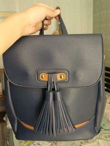 Blue leatherite backpack with magnetic shutters