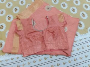 Elegant Peach Saree with Intricate Embellishments