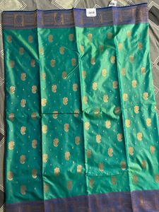 Elegant Teal Saree with Gold Paisley