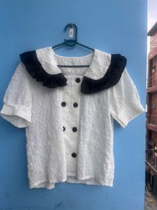Chic White Top with Black Collar