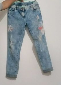 Distressed Denim Jeans with Floral Appliques