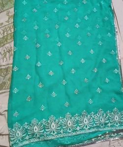 Elegant Teal Saree with Silver Embellishments