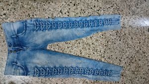 Stylish Blue Denim Jeans with Lace-Up Detail