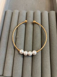 Elegant Pearl & Gold Tone Cuff Bracelet