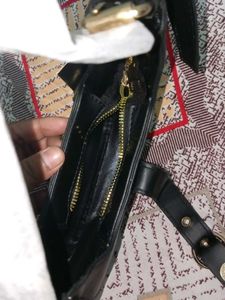Chic Black Hobo Bag with Gold Accent