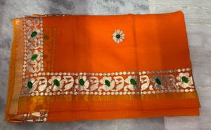 Vibrant Orange Saree with Intricate Border