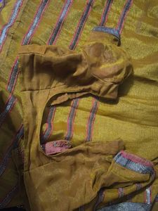 Elegant mustard heavy party wear saree with blouse