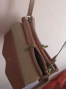 Peach Colour Sling Bag With 2 zips Can Carry Mobile ,wallet Cards And Make Up Items.