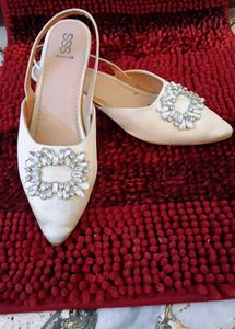 17. Elegant White Slingback Heels
