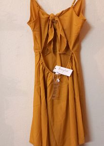 Today's Offer ₹150 Berrylush Women Solid Yellow Front Twist Knot Fit &amp; Flare Mini Dress For Women (Mustard Colour)