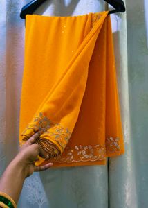 Vibrant laddu yellow colour Diamond Work saree