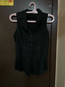 Black Vest with White Ruffle Blouse