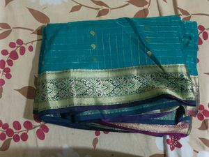 Elegant Teal Saree with Golden Border