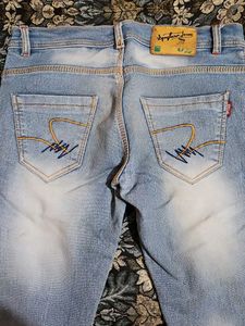 Light Wash Distressed Denim Jeans