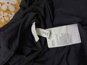 Sleek Black Turtleneck Sleeveless Bodysuit