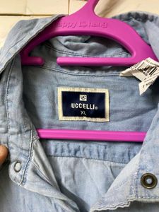 A MILDLY BLUE FADED DENIM SHIRT