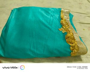 Stunning Teal Saree with Gold Embellishments