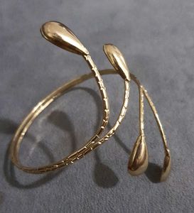 Elegant, Trendy Gold Spiral Arm Cuff