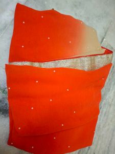 Vibrant Orange Saree with Pearl Embellishments