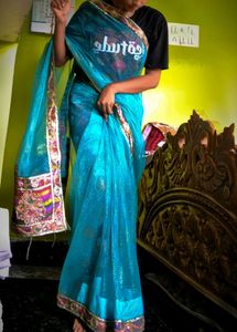 Teal Embellished Net Saree