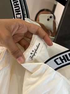 Chic White Button-Up Blouse with Logo Straps
