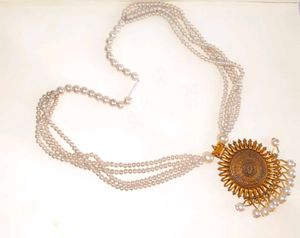 Elegant Pearl Necklace with Sun Pendant