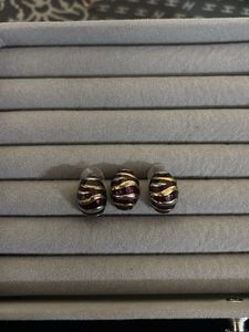 Elegant BAZA Vintage Tone Earrings with doller