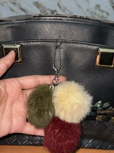 Chic Black Handbag with Pom-Pom Charm