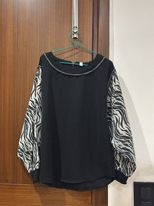 Stylish black top with zebra designed sleeves