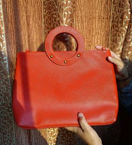 Chic Orange Handbags