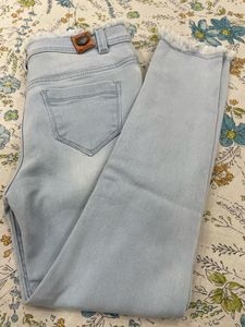 Light Wash Denim Jeans with Frayed Hem